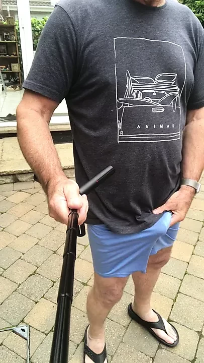 commando in thin blue shorts outdoors