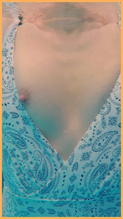 Wife flashes her pussy in the hotel pool.