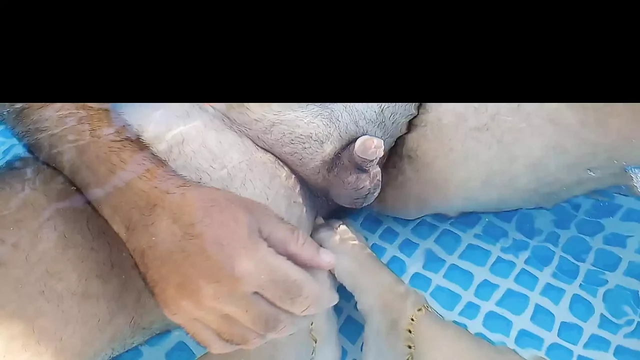 Girlfriend plays with my cock in the pool with her cute little toes and feet