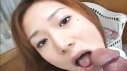 Horny Japanese teen sucks and gobbles a thick cock on her kn