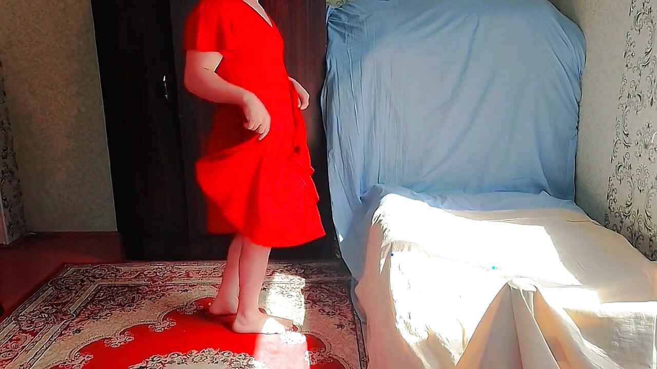 Cute sissy holding stuffed bunny in bed playfully