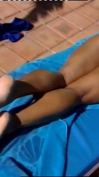 Wonderful MILF with Nice Tits Massages Her Feet by the Pool While Sunbathing