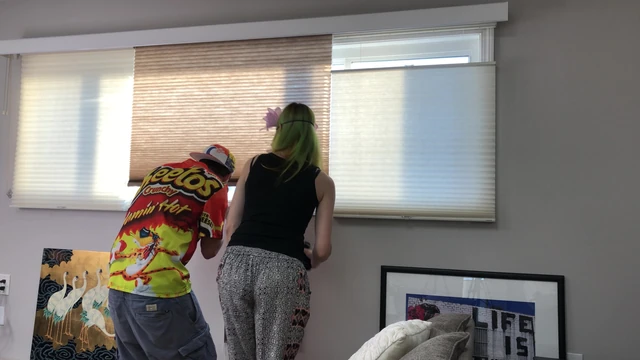 Couple Peeping Outside Apartment Window