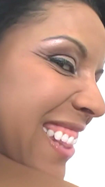 A Latina woman with tattoos engages in cephalalgia and displays a grin while getting a male's robust genitalia. | Clip 1