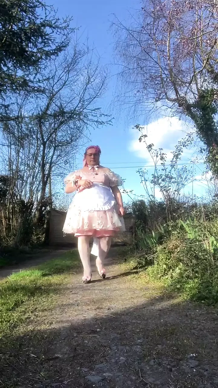 In a babydoll outfit to pee a second time in the diaper outside