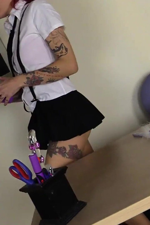 Tattooed redhead toying cunt in foot fetish video