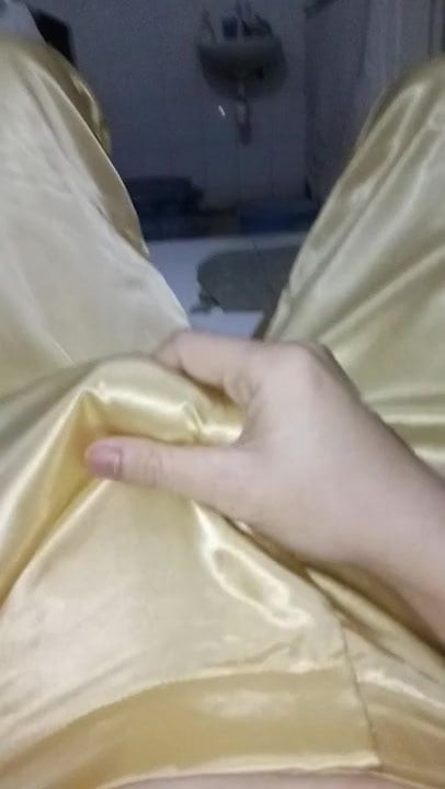 Cum with shiny gold pants
