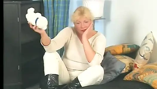 Blonde gilf wearing stockings while dildoing pussy