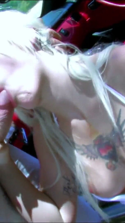 Tattooed blonde hitchhiker Milky Cooper gets banged by a big cock in a convertible | Clip 1
