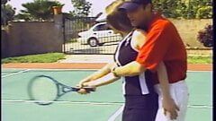Lusty brunette gets horny after a tennis match and fucks a stud on the court