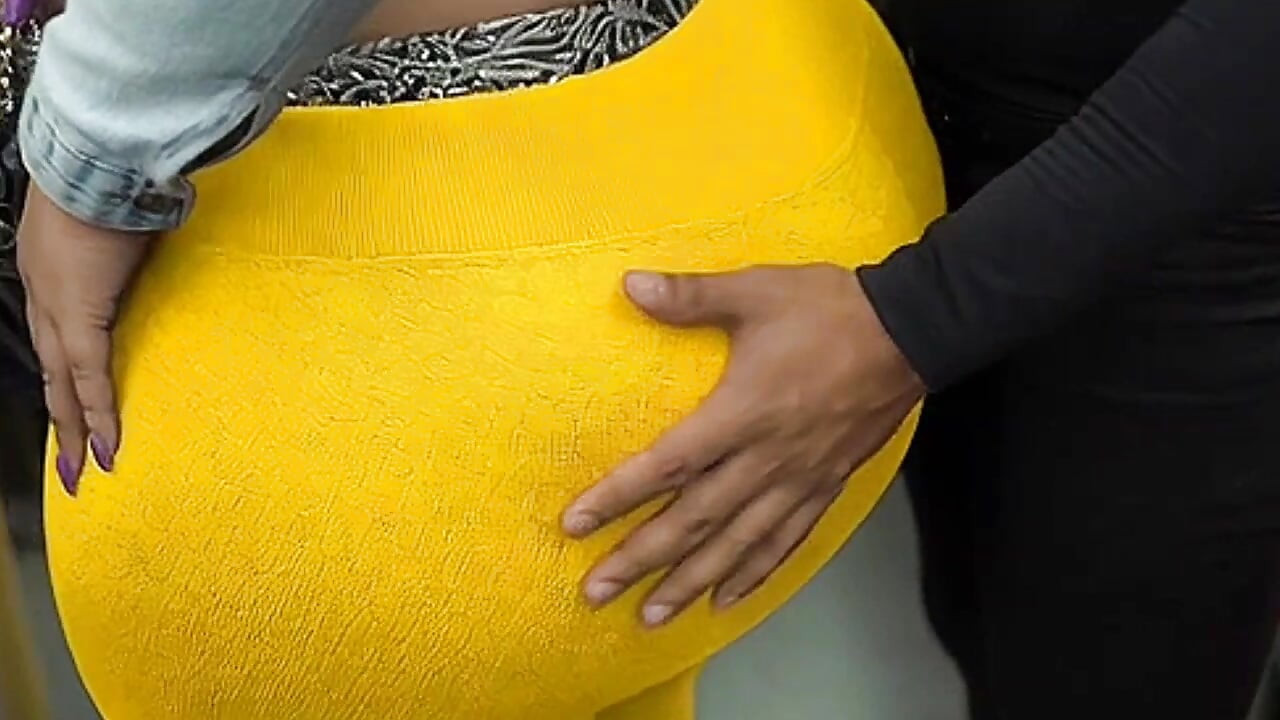 "Masked BBW Teases Huge Ass in Shiny Yellow Leggings on Public Bus"