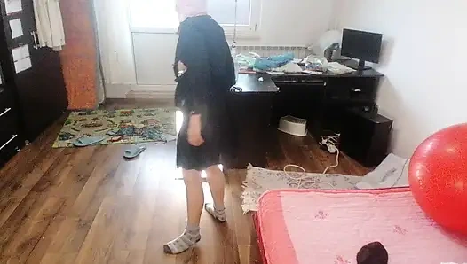 Sexy brunette doing naked chores around the house.