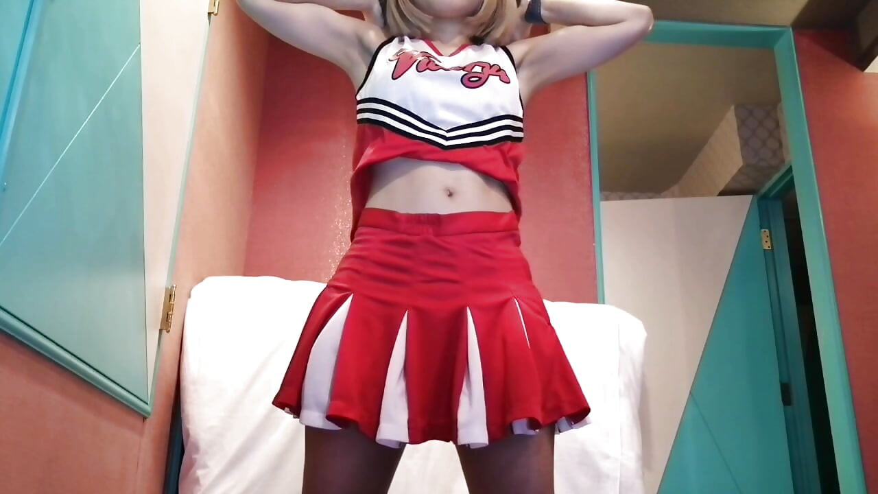 A cute, busty married woman does five exercises in a sexy cheerleader costume. Peeking down from below. Home made amateur Private Shoot
