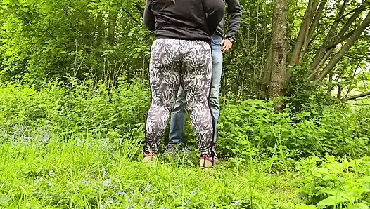 Son-in-law's hands are busy with mother-in-law's sexy ass while she jerks off his cock in nature