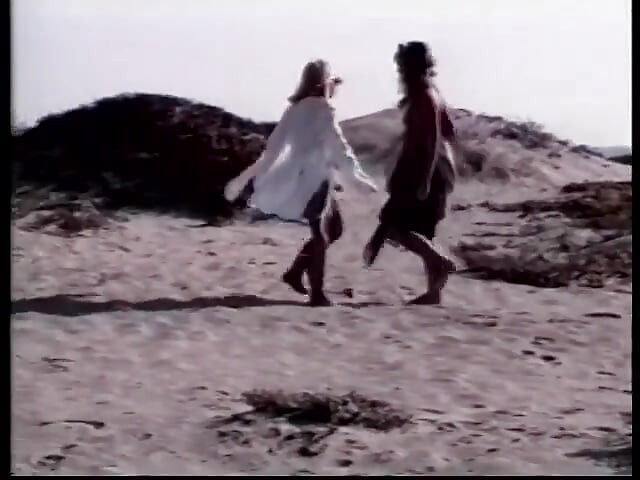 Two blondes with great bodies are fucking sensually on the beach