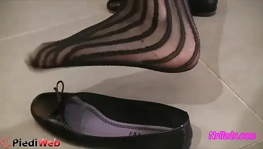 Nyllady Footplaying with a Phone Card in Patent Black Stockings