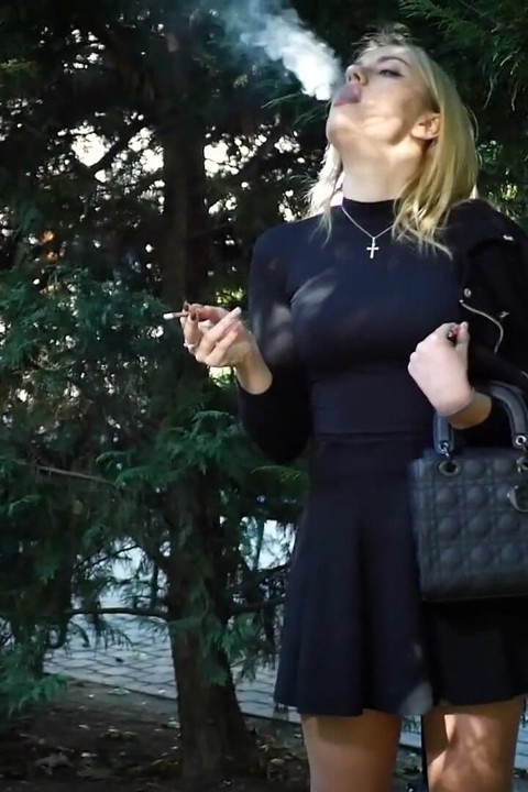 Hot Blonde Babe Smoking Two Black Cigarettes in Nature