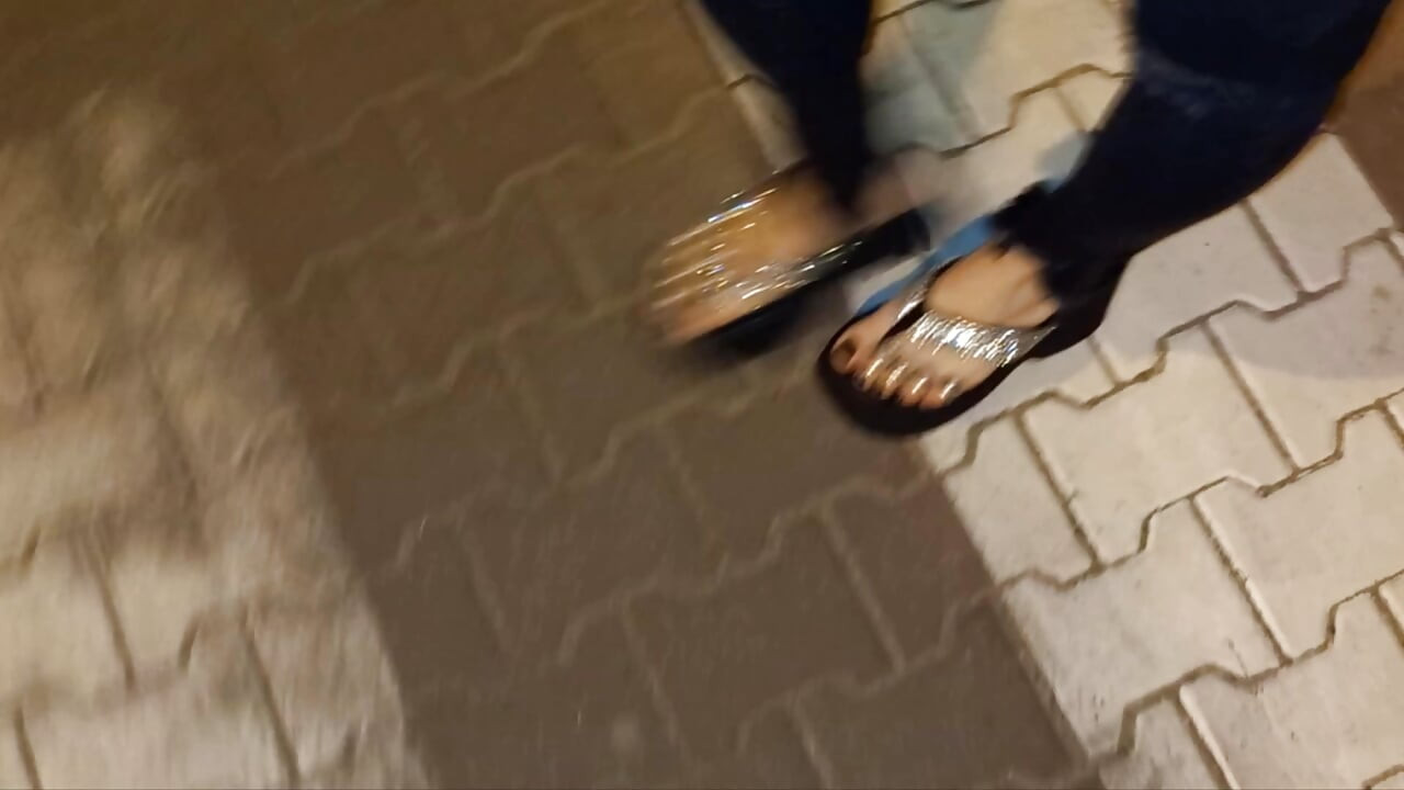I wear platform flip-flops and tight jeans, showing off my feet.