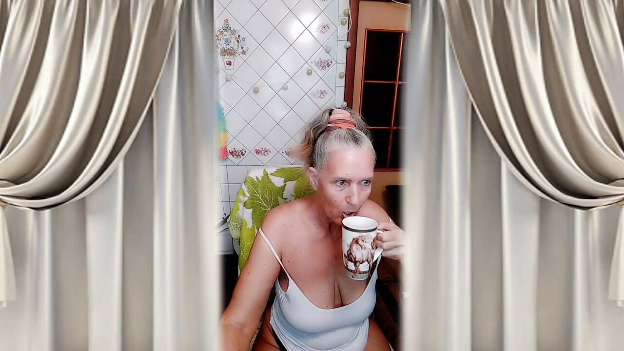 Cheerful housewife Lukerya in the kitchen
