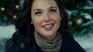 Gal Gadot outside at Christmas time.