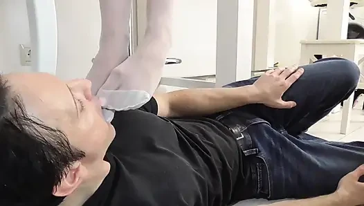Princess Kirstin let her white stocking feet lick and kiss by her slave Bobby.