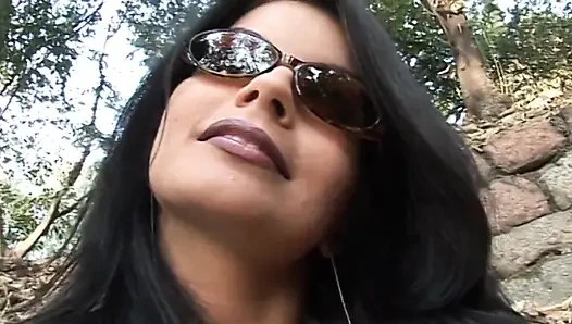 Hot and sexy milf fingers her pussy on the bench of a park