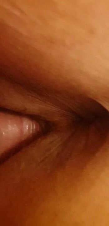 Bent over, lips spread