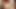 I am naked, lying on the bed with my legs spread and smoking a cigarette
