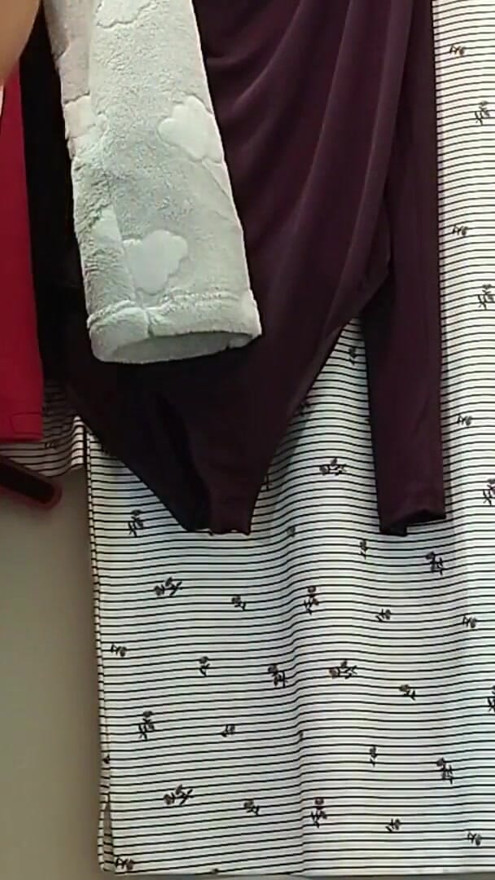 Sexy mom tries on pantyhose. Sexy brunette tries on clothes in fitting room. | Clip 1