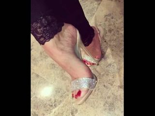 Beautiful feet with red nail polish