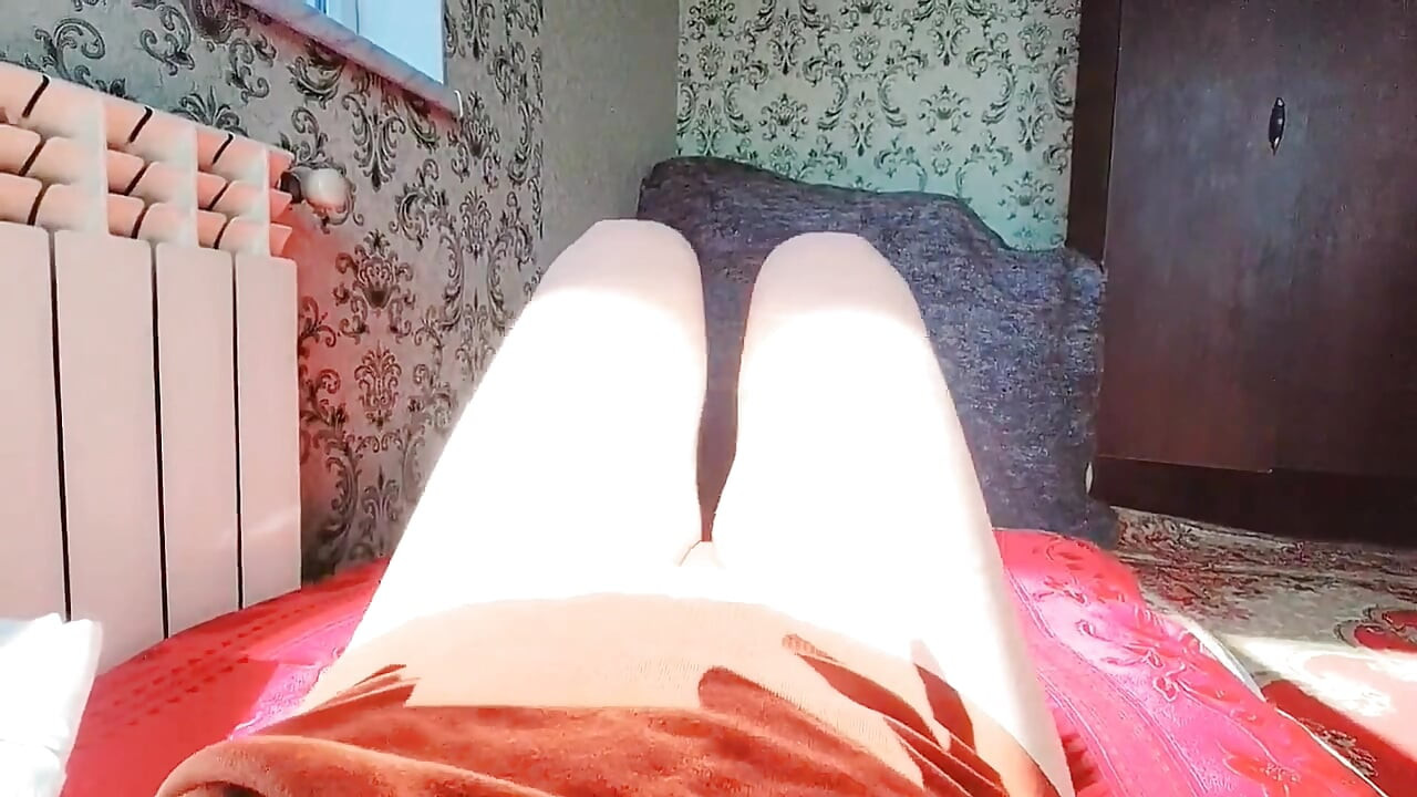 Lovely femboy sitting on bed wearing oversized shirt