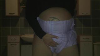 Pregnant peeing in her diaper