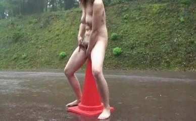 Amateur chick riding an orange cone