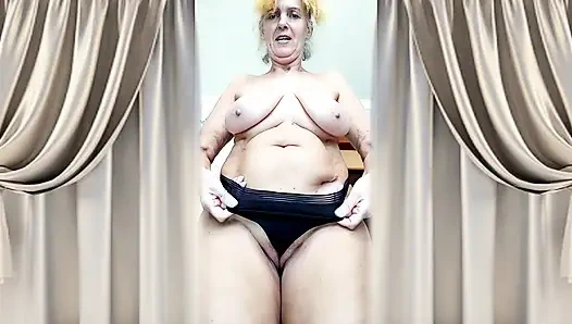 Cheerful, curvy housewife Lukerya flirts with admirers in the kitchen.