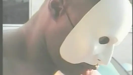 Muscular Stranger in White Superhero Mask Drills Ebony Chick on the Parking of Shopping Mall