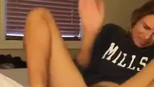 Spanking her own pussy.