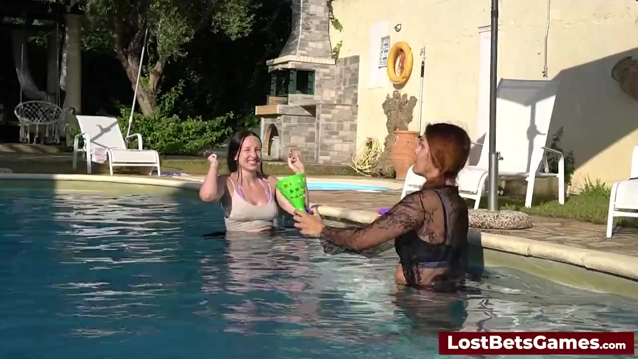 A strip down game outdoors in the swimming pool