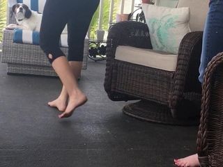 Wife and sister-in-law barefoot on the porch