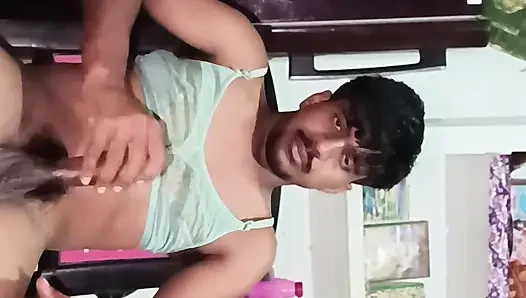 The boy is dancing while sitting on a chair