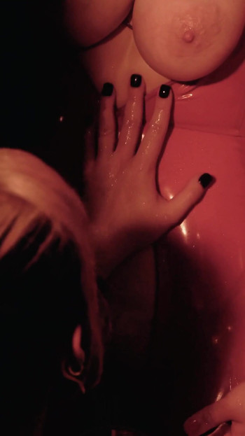 Iconic moment from "Sexy Lesbian Petting in Latex - FREE porn video"