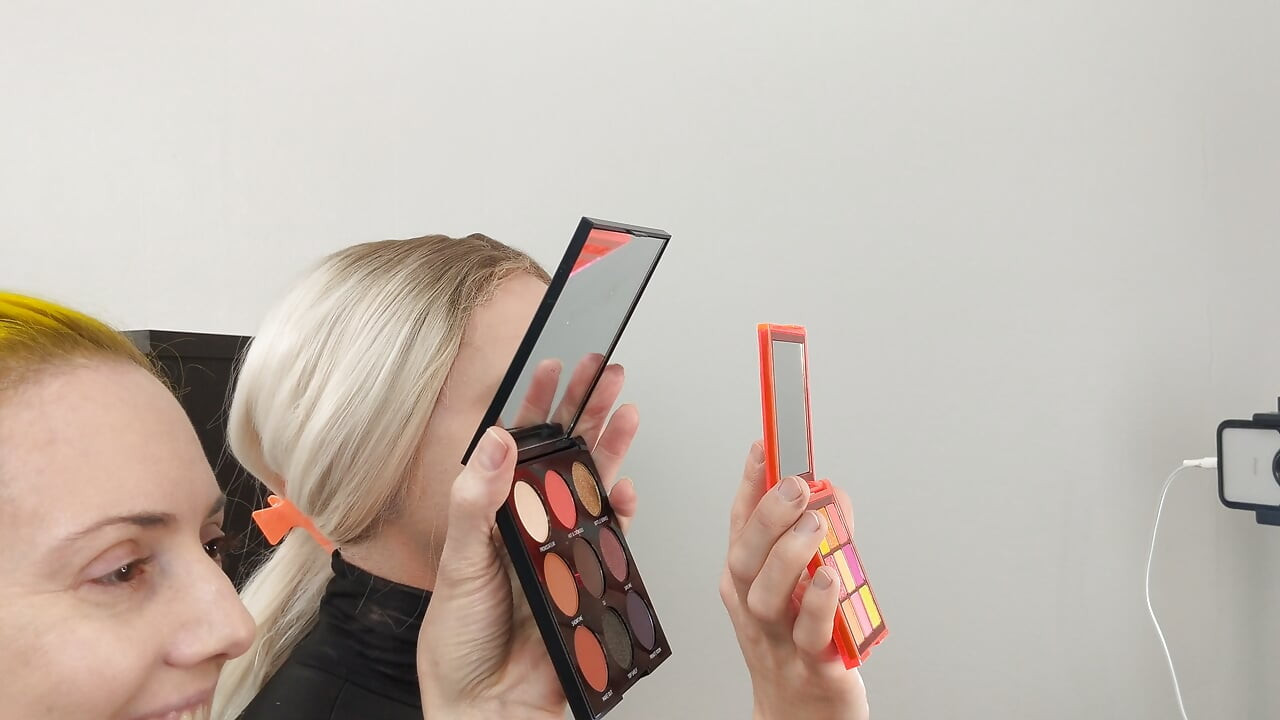 Sissy Bailey Wilde and Woman Putting on Foundation and Eye Shadow