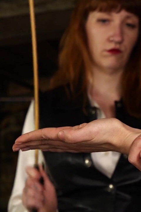 Slave Mila Endures 24 Cold-hearted Hand Caning Strokes From Mistress Roxy