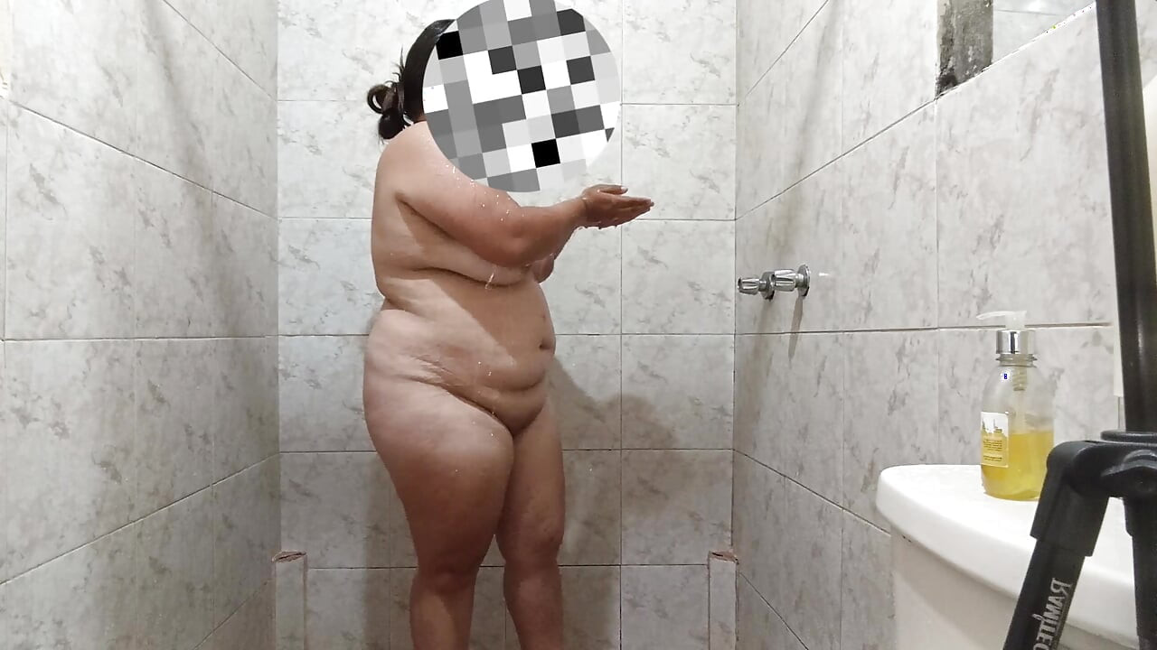 Sexy Latin girl touches herself very rich while showering rich and has giant breasts.