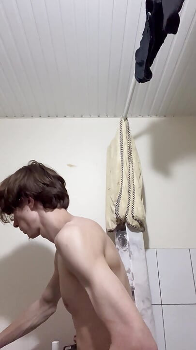 Sexy boy taking a shower