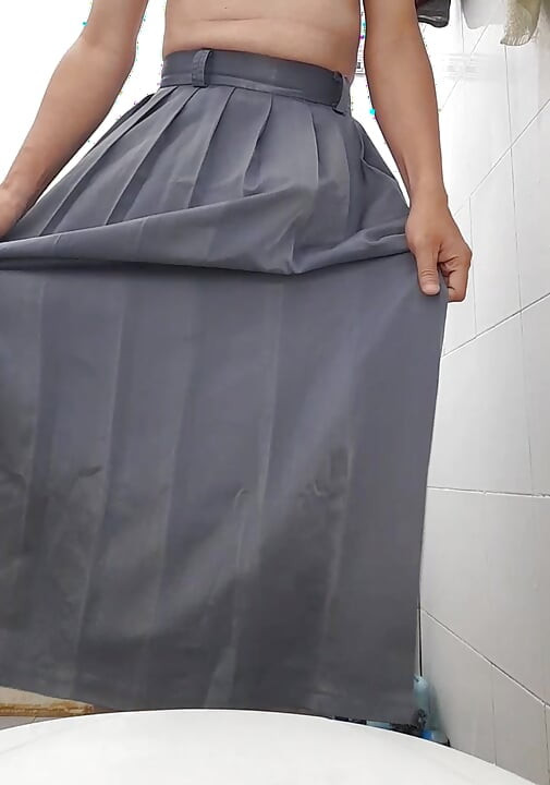 Crossdressing wearing grey school girl skirt (rok abu sma)