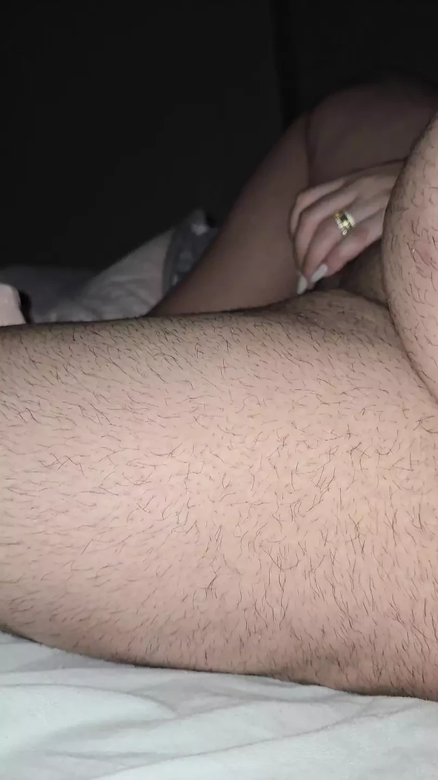 Step mom handjob step son dick while sitting naked in bed and waching on tv