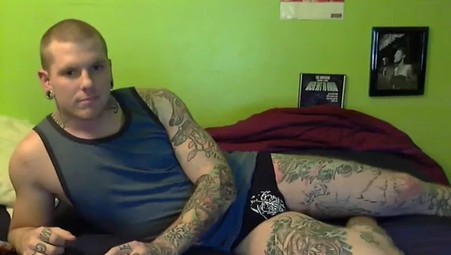 Tattooed gay jerks of in front of a cam