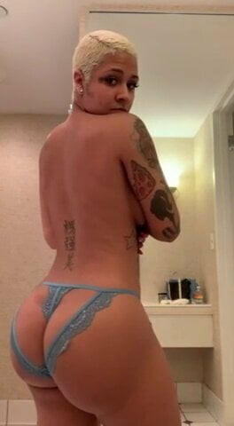 Tattooed babe dancing