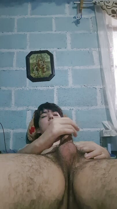 Horny young man masturbates alone and naked