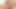 Curly-haired ladyboy with big boobs spreads her shaved